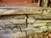 Cracked foundation on century old log cabin